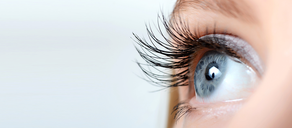 Female eye with long eyelashes close up